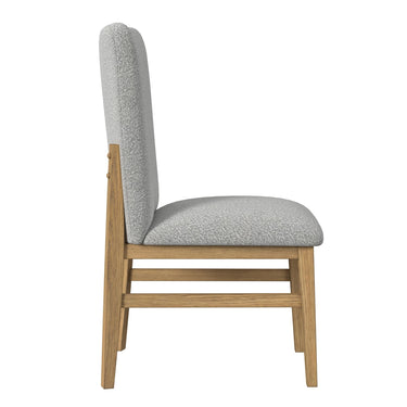 Side profile of Portland side chair in natural wood with gray fabric and leg stretchers