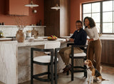 Elements International Portland - Arm Barstool with White Fabric styled in a designer-styled interior lifestyle setting at Quality Home Furniture