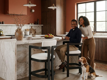 Elements International Portland - Arm Barstool with White Fabric styled in a designer-styled interior lifestyle setting at Quality Home Furniture