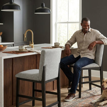Elements International Portland - Square Back Barstool with Grey Fabric styled in a designer-styled interior lifestyle setting at Quality Home Furniture