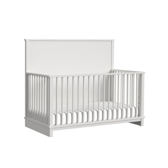 Wyller crib in white finish, angled view showing solid back panel and spindle sides