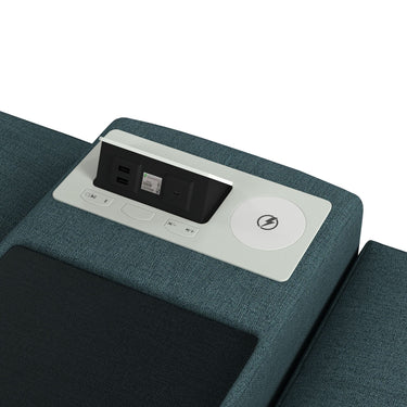 Console top with power strip, USB ports and charging pad beside a teal ottoman