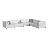 Zandara 7 piece modular sectional in beige with center console, corners and armless chairs, angled view