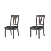 Two Nathan fan back dining chairs in gray oak with black faux leather seats, angled front view