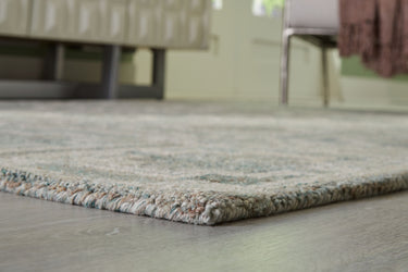 Jossland - 5' x 7' Rug - Turquoise / Ivory