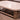 Dolan Creek - Beige / Brown - Rectangular Cocktail Table