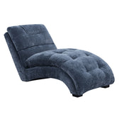 Dominick chaise in blue Amigo Slate fabric, angled front view showing tufted seat and arched base