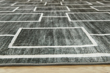 Elderland - 5' x 7' Washable Rug - Black / Gray