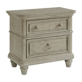Whit-Ash 2-drawer nightstand in light gray, angled view showing paneled drawers, round knobs and bun feet