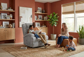 Artemis Power Lift Chair in Softcat Silver, living room scene with a man and child reading in it