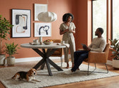 Axel round dining table with light grey top and espresso crossed pedestal base in a terracotta dining room