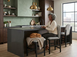 Elements International Portland - Round Back Counter Stool with Grey Fabric styled in a designer-styled interior lifestyle setting at Quality Home Furniture