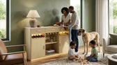 Cambrie buffet in natural and off-white with glowing base styled in a green living room with family